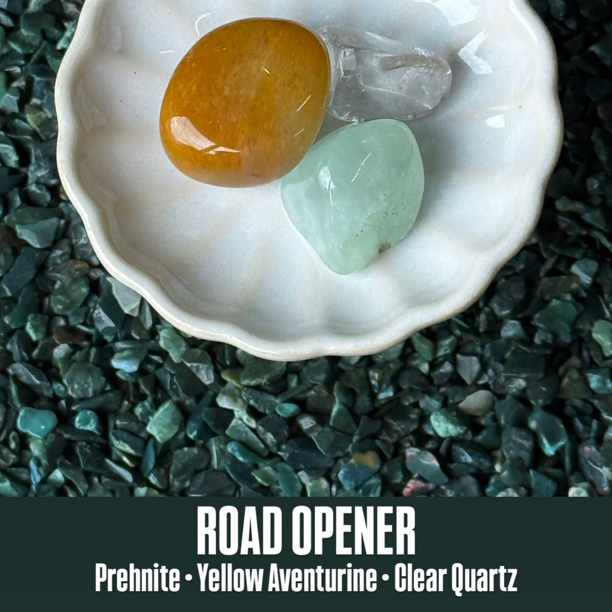 Shell with prehnite, yellow aventurine, and clear quartz on a dark stone background