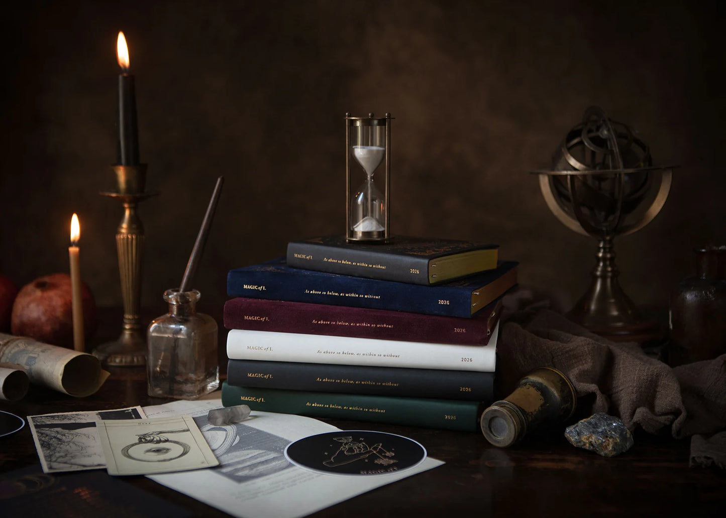 Stack of books with candles, an hourglass, and a globe on a dark background