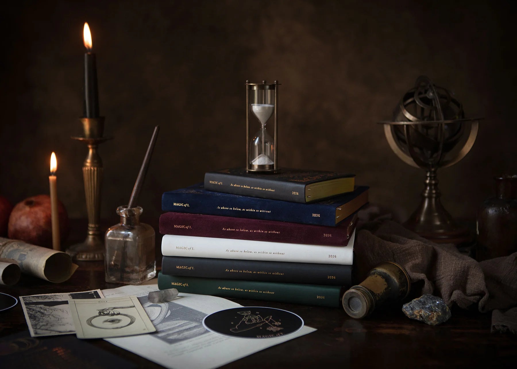 Stack of books with candles, an hourglass, and a globe on a dark background