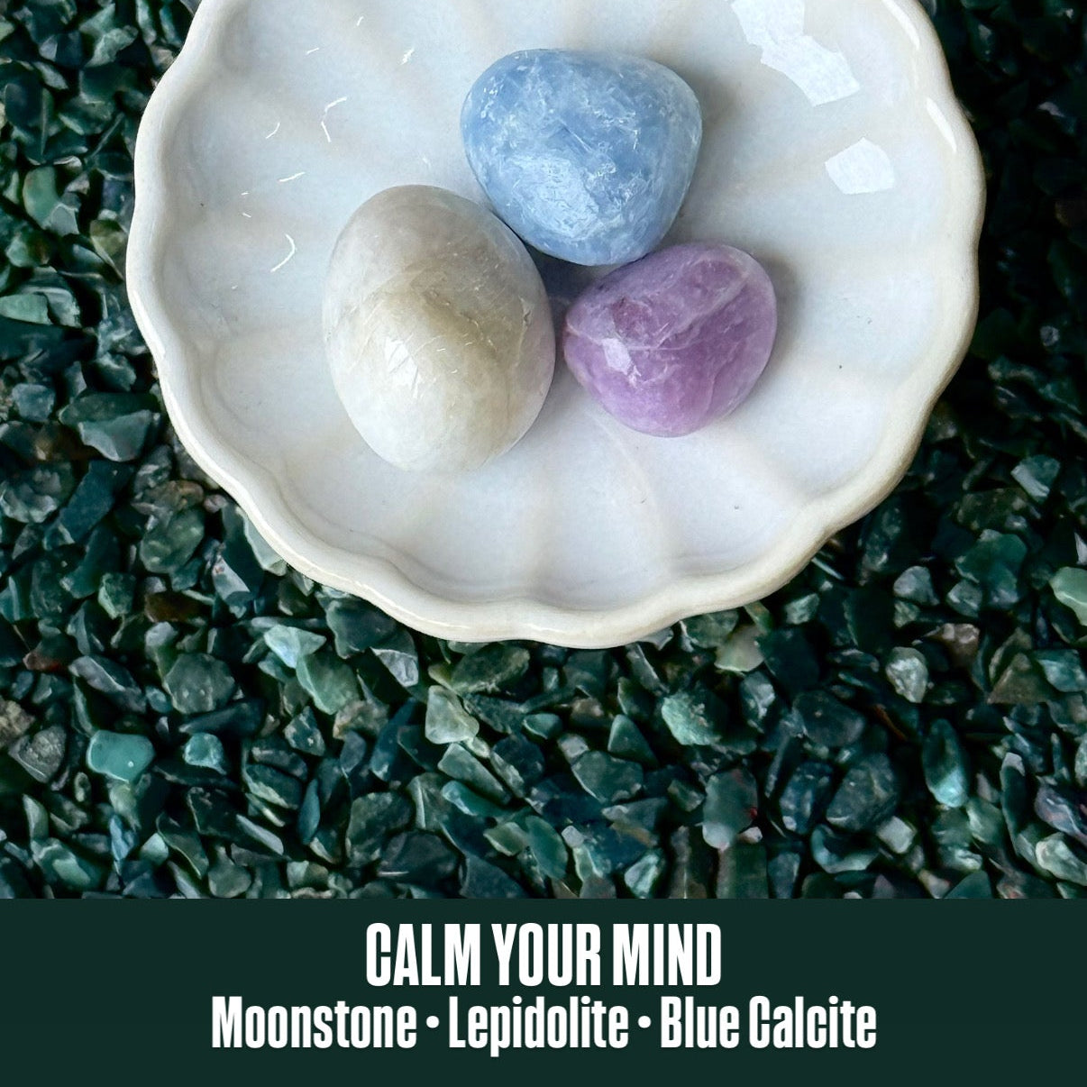 Three colorful stones in a white dish on a textured green surface with text 'Calm Your Mind' and stone names.