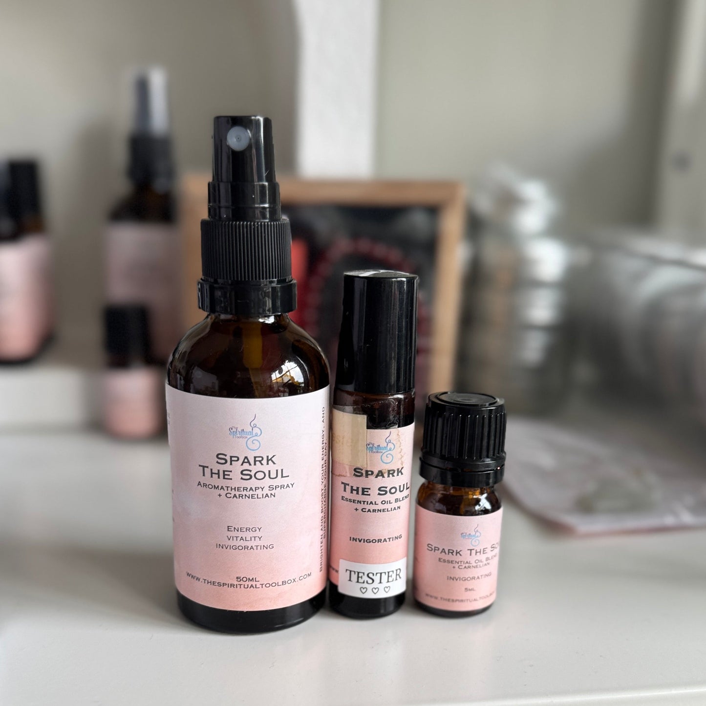 Bottles of 'Spark the Soul' products on a shelf with a blurred background