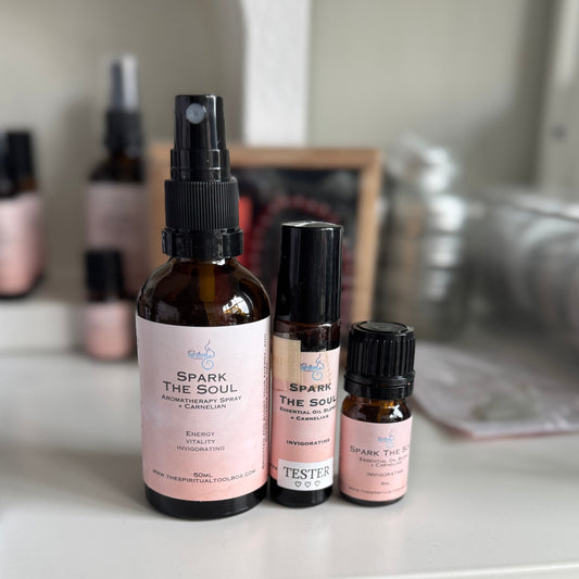 Bottles of 'Spark the Soul' products on a shelf with a blurred background