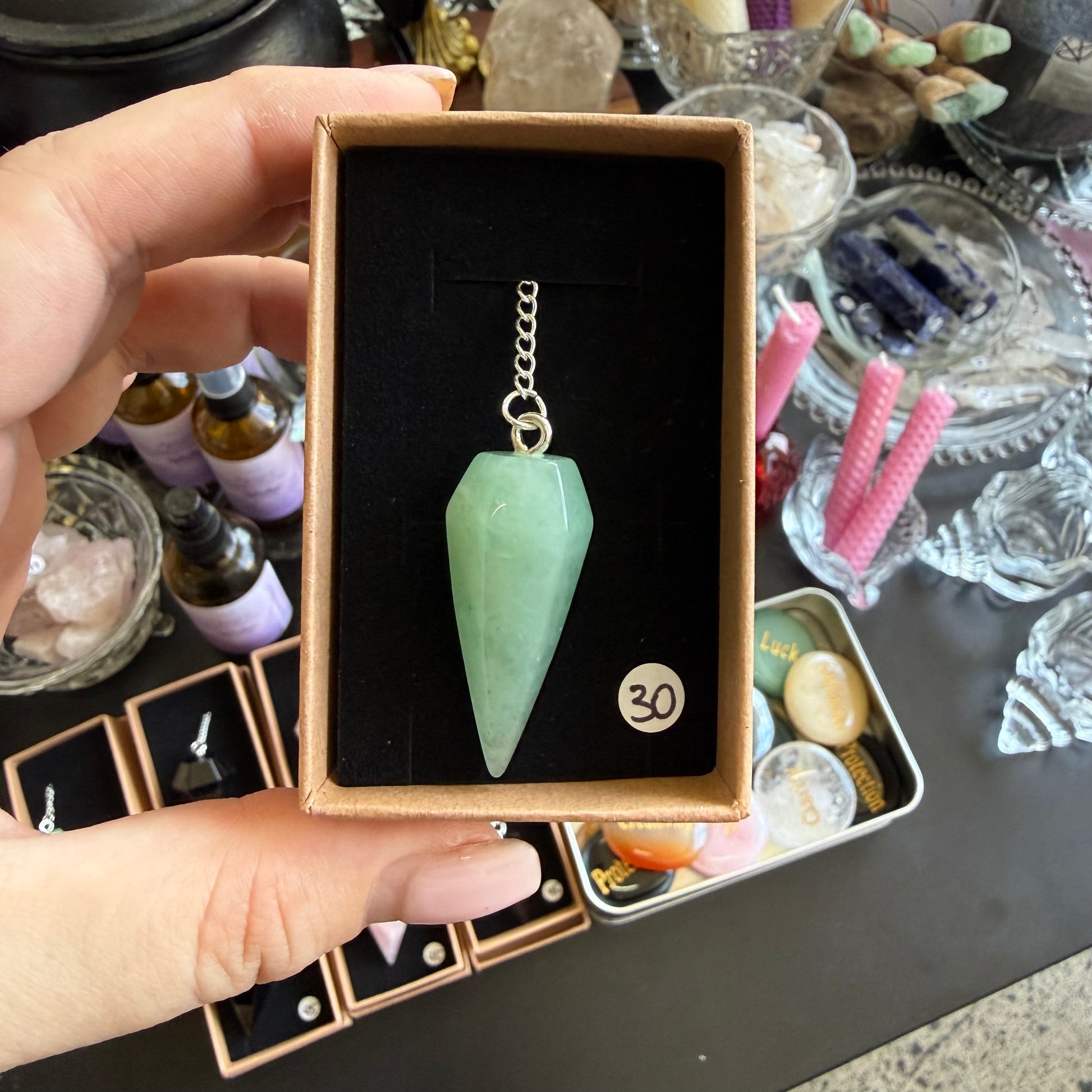 green aventurine pendulum in a box
