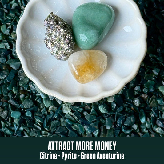 Three stones in a shell on a dark green textured background with text 'Attract More Money' and stone types listed.